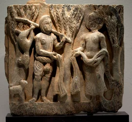 Kleding ruilen met een jager. Laag reliëf gebeeldhouwd, kunst van Gandhara (Pakistan), 2e-3e eeuw. Nationaal Museum van Korea, Seoul (Zuid-Korea)