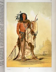 Indiaanse Blackfoot sjamaan met tamboerijn en speer