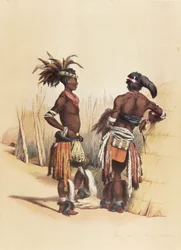 Twee jonge Zulu-mannen, gekleed in kleurrijke traditionele kleding