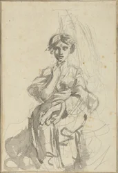 Zittende vrouwenfiguur