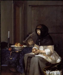 Een moeder die een appel schilt