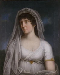 Vrouw in een witte jurk met een sluier