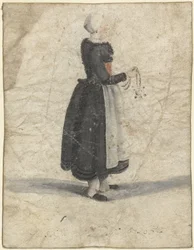 Noord-Hollandse vrouw staand met een ornament of tas in de hand