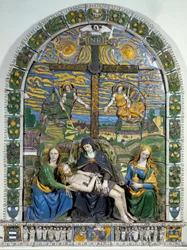 De Kruisafneming (Pieta) Jezus Christus en de Maagd Maria omringd door Sint Jan en Sint Maria Magdalena voor het kruis met de inscriptie INRI (I.N.R.I.).