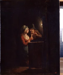 Een man en een vrouw bij kaarslicht