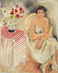 Vrouw op een stoel - Bloemen op tafel, of anjers