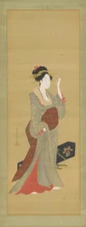 Een geisha die op het punt staat een schildpad haarspeld aan te passen