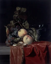 Een stilleven van druiven, perziken, walnoten en een wijnglas