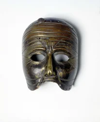 Bronzen masker van de 