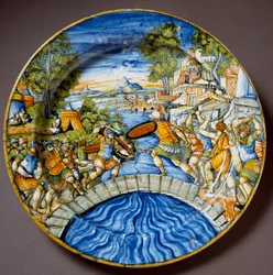 Episode uit de verdediging van de Pons Sublicius door de legendarische Romeinse held Horatius Cocles tijdens de strijd tegen de Etrusken. Keramische schaal vervaardigd in Urbino in het atelier Fontana, Italië. Omstreeks 1560. Florence, Museo Nazionale del