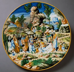 Mozes laat water uit de rots stromen en geeft het volk van Israël te drinken. Keramische schotel vervaardigd in Urbino in het atelier Fontana, Italië. Omstreeks 1560, Florence, Museo Nazionale del Bargello