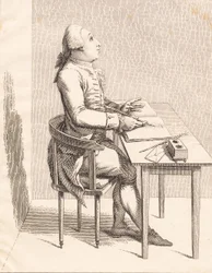 Een heer aan een bureau