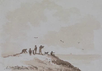 Waarnemers op een heuvel met uitzicht op de zee