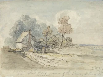 Een rieten huisje en bomen aan het begin van een landweg