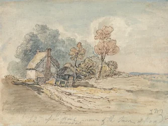 Een huisje met rieten daken en bomen in de bocht van een landweggetje