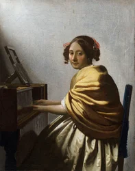 Jonge vrouw zittend aan een virginaal - Schilderij van Jan Vermeer (Johannes) (1632-1675) circa 1670