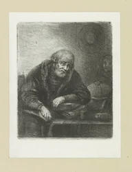 Oude man aan zijn bureau