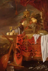 Een mand met gemengd fruit met vergulde beker, zilveren kelk, nautilus, glas en perziken op een bord