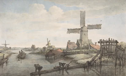 Uitzicht op een kanaal met drie windmolens