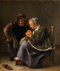 Een vrouw die een kous verstelt