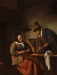 Een oud echtpaar dat een warme drank bereidt