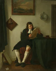 Interieur met een man die leest