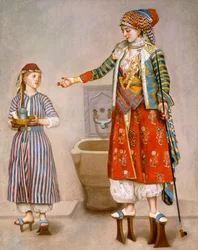 Een vrouw in Turkse kleding in een hamam die haar dienaar instrueert