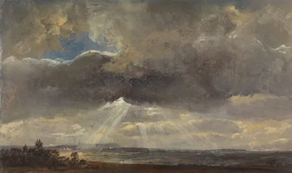 Wolken en zonnestralen boven de Windberg bij Dresden