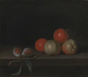 Appels en perziken op een tafel