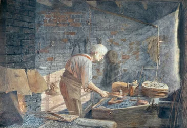 Een smid aan het werk in zijn smederij