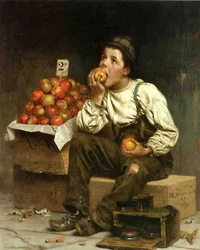 Een jongen die appels eet