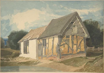 Boerderijgebouw bij een vijver