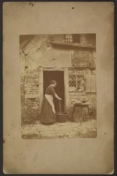 [Woman in doorway]