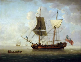 Een Britse brigantijn, met de rode vlag en de Union Jack, offshore in een kalme zee