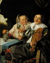 Het vrolijke gezelschap: een violist en een vrouw schenken hem een glas wijn in, beiden dronken. Schilderij van Judith Leyster (1609-1660)