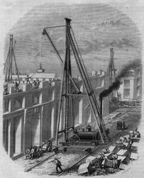 Stoommachine gebruikt op een bouwplaats van een huis. Gravure door Gagniet in 