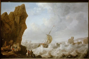 Vissersboot in stormachtige zee voor een rotsachtige kust