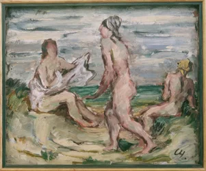 Drie naakte vrouwen op het strand