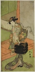 De acteur Yamashita Kinsaku II als Miyagino vermomd als kapper in het stuk Kosode-gura no Tekubari, uitgevoerd in het Morita Theater in de tweede maand, 1772 (?)