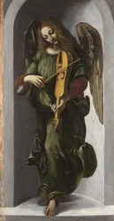 Een engel in groen die de draailier bespeelt