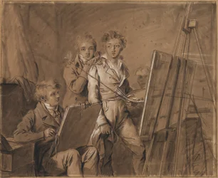 Drie jonge kunstenaars in een atelier