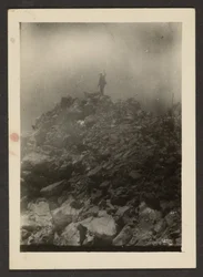 [Man Atop Rock Pile]