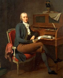 Portret van man zittend aan zijn bureau