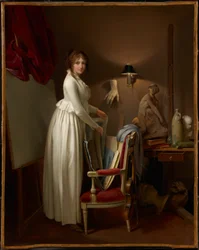 De vrouw van de kunstenaar in zijn atelier