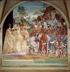 Sint Benedictus van Nursia verwelkomt Totila (6e eeuw) koning van de Ostrogoten fresco van de refter van de monniken gemaakt door Luca Signorelli die het leven van Sint Benedictus van Nursia (480 - 567) stichter van de Orde van Benedictijnen vertelt. 1503