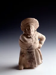 Precolumbiaanse kunst, Mayabeschaving, klassieke periode: antropomorf beeldje van klei dat een balspeler voorstelt en als muziekinstrument dient. Uit San Agustín Acasaguastlán, El Progreso, Guatemala. Afmetingen: 19 x 8,5 cm. Guatemala, Nationaal Museum