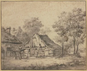 Huizen onder bomen, met een op een paal gemonteerd wiel