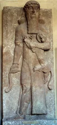 Mesopotamië: standbeeld van Sargon die een leeuw bedwingt, genaamd Gilgamesj, hof van Khorsabad, 8e eeuw. Parijs, Louvre