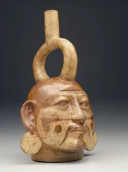 Stijgbeugel-uitloopvat in de vorm van een mannenhoofd, ca. 450-550 n.Chr.
