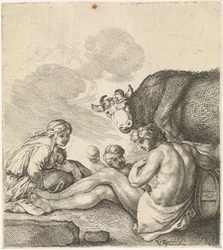 Rustende familie bij een koe